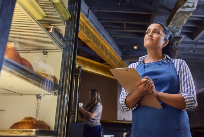 Restaurant owner checking firdge inventory